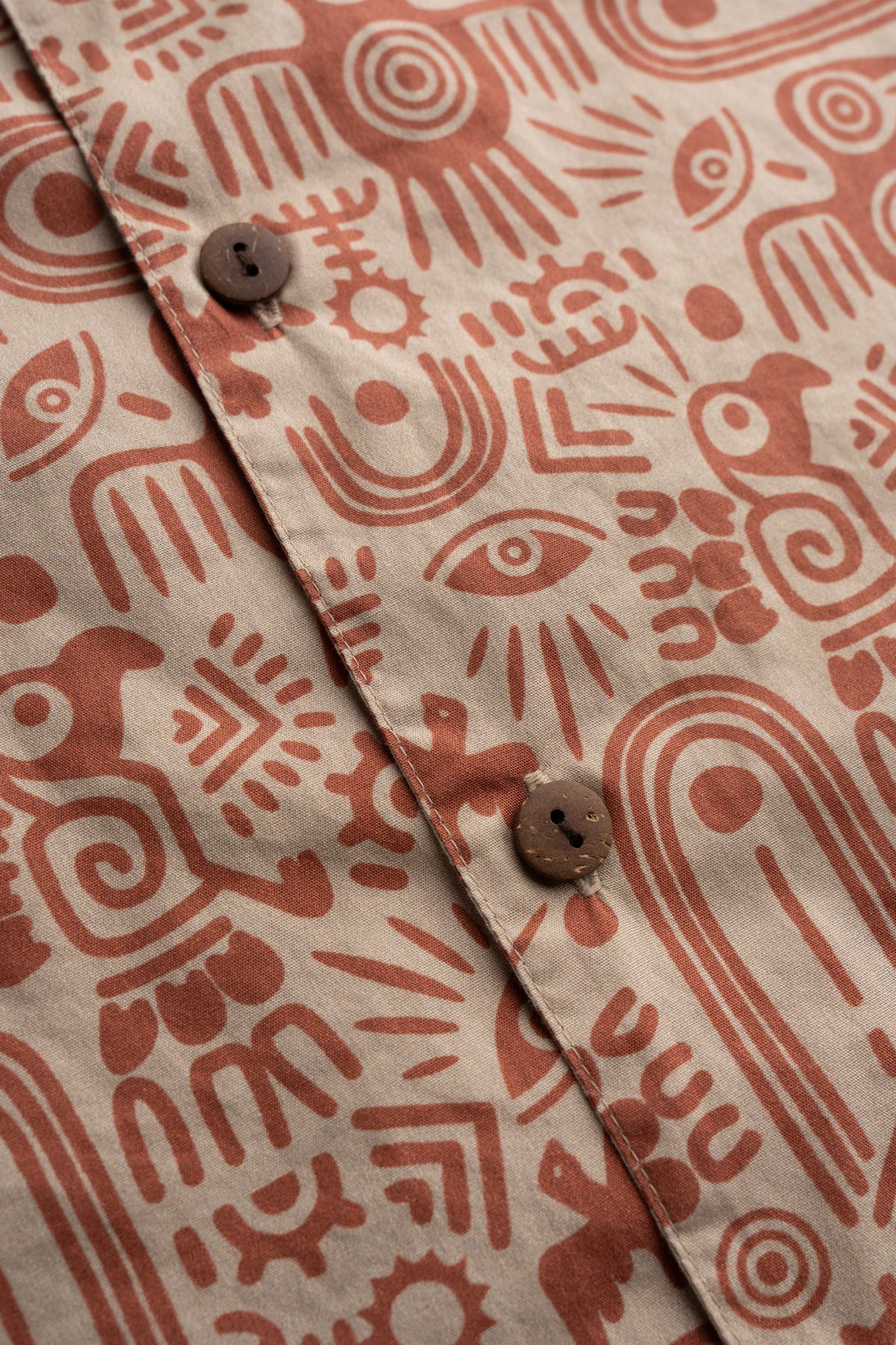 Men’s poplin cotton button up shirt, detailed close-up to showcase quality of fabric, graphic, buttons