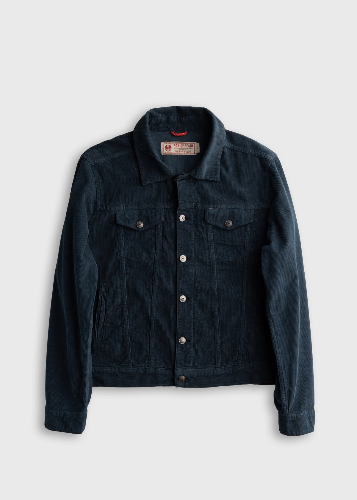Dark blue denim jacket with button closure and chest pockets, displayed on a plain background.