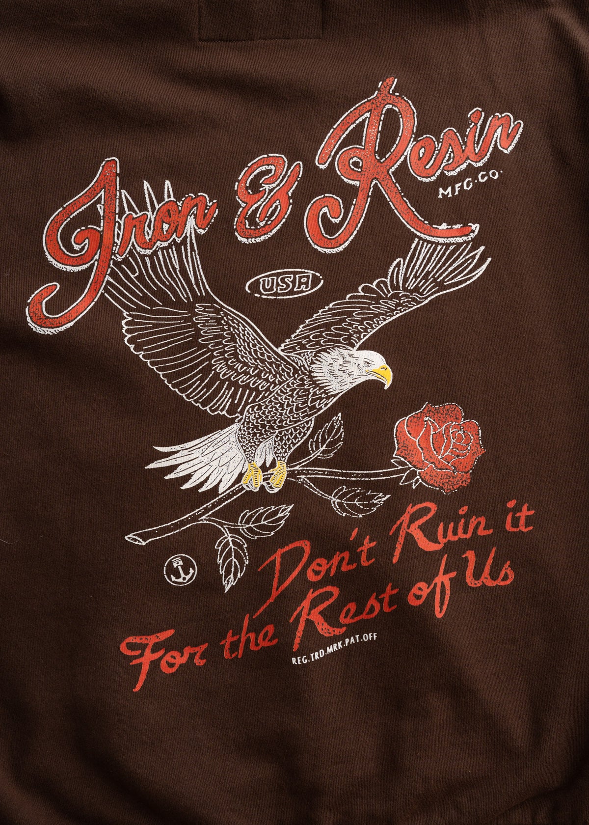Close up of 9.5 oz cotton cross terry fabric and custom graphic, showing soft texture and garment dyed finish