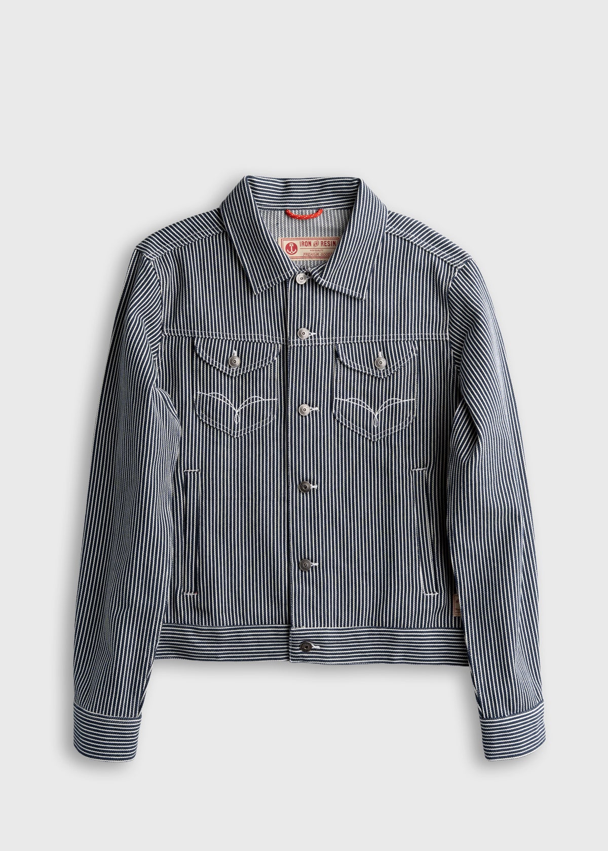 Blue and white striped denim jacket with button closure and chest pockets on a plain background, showcasing casual style.