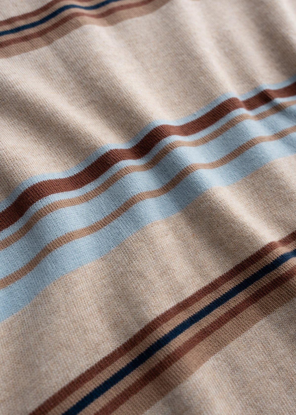 Close up of knit cotton blend fabric showing soft texture and breathable construction