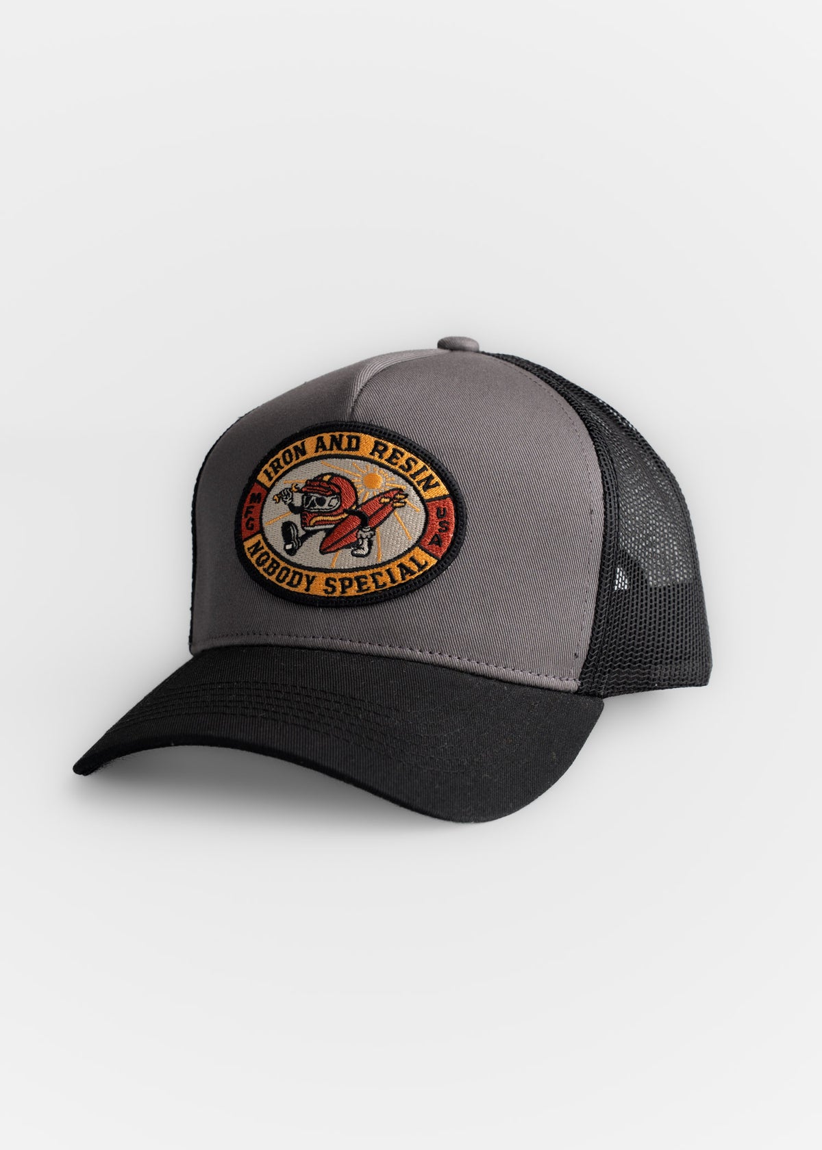 Gray and black trucker hat with "Iron and Resin" patch featuring a motorcycle design, reading "Nobody Special" on the front.