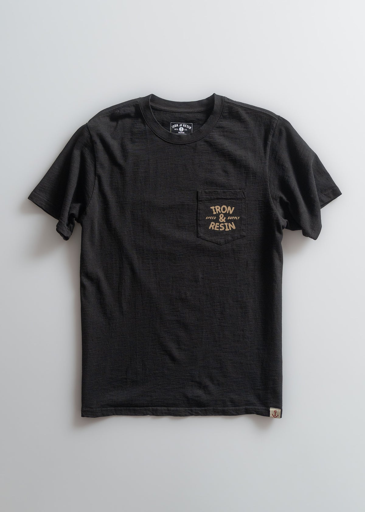 Black T-shirt with "Iron & Resin" logo on chest pocket, displayed on a light background. Simple, casual design.