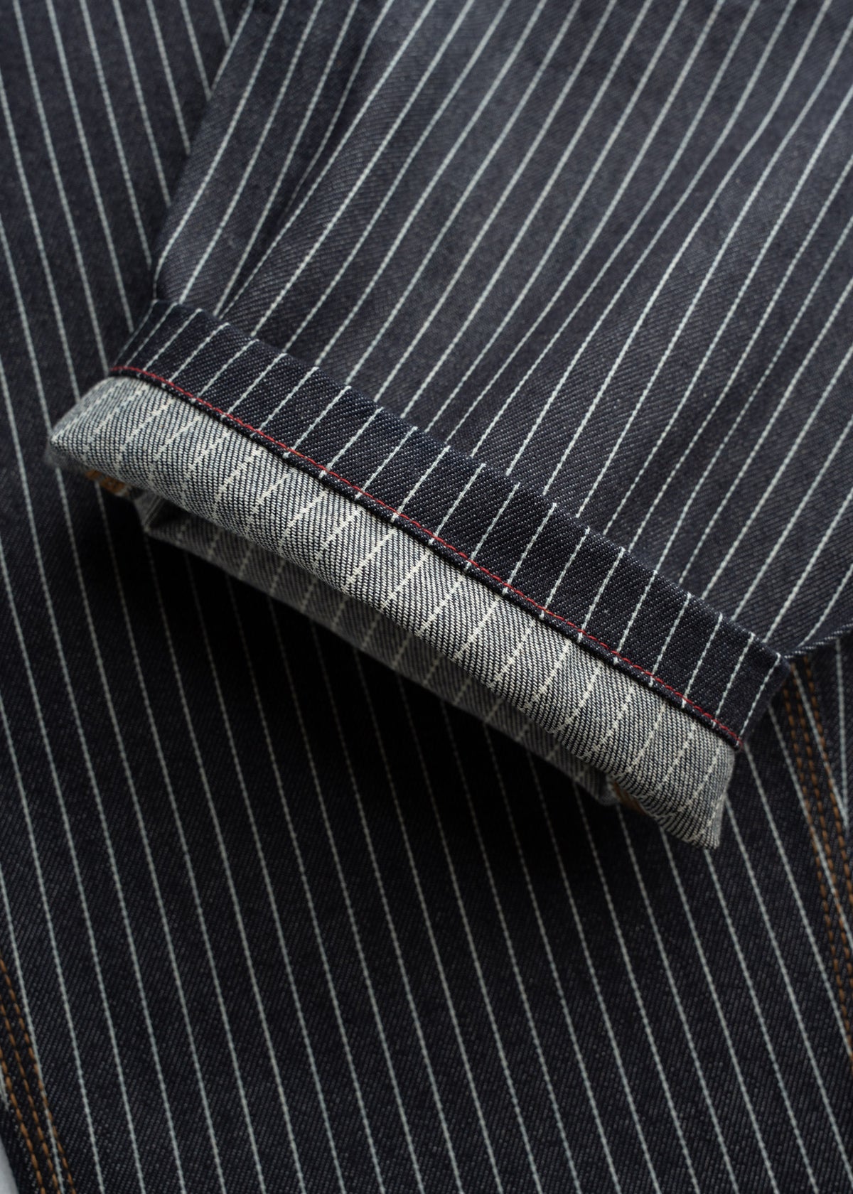 Close up of leg opening and seam construction, highlighting roomy fit and classic workwear build