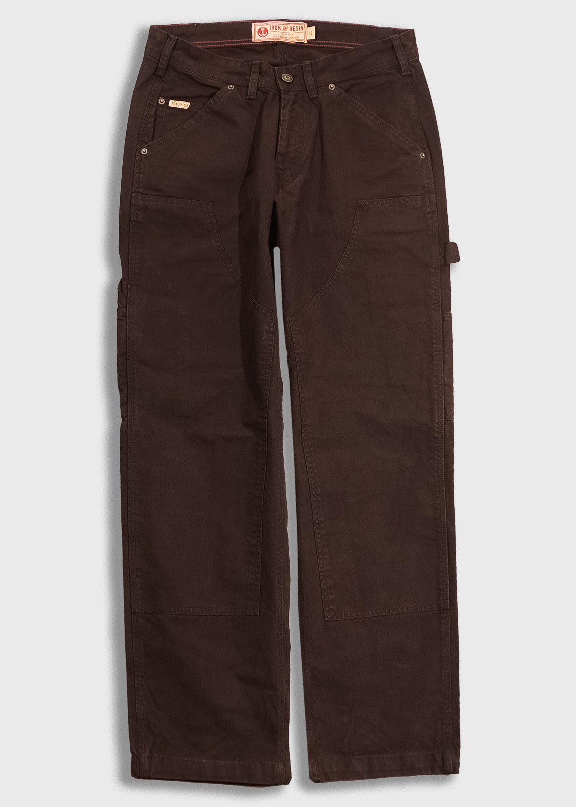 Brown work pants with multiple pockets and a tool loop, designed for durability and functionality.