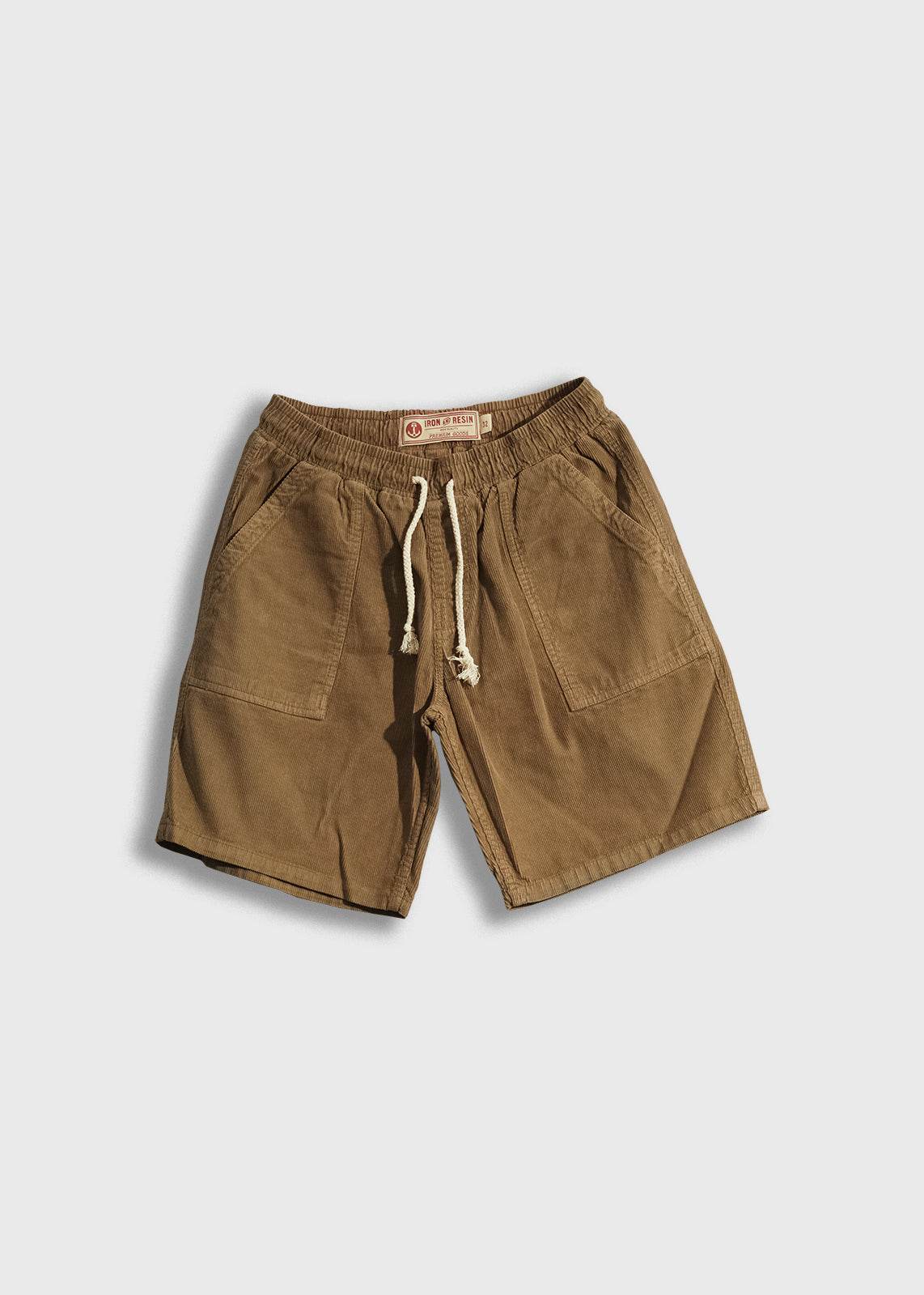 Men’s 14 wale corduroy shorts with garment dyed and triple washed finish, elastic waistband with drawstring and patch pockets, durable workwear inspired short with relaxed fit and 9 inch inseam
