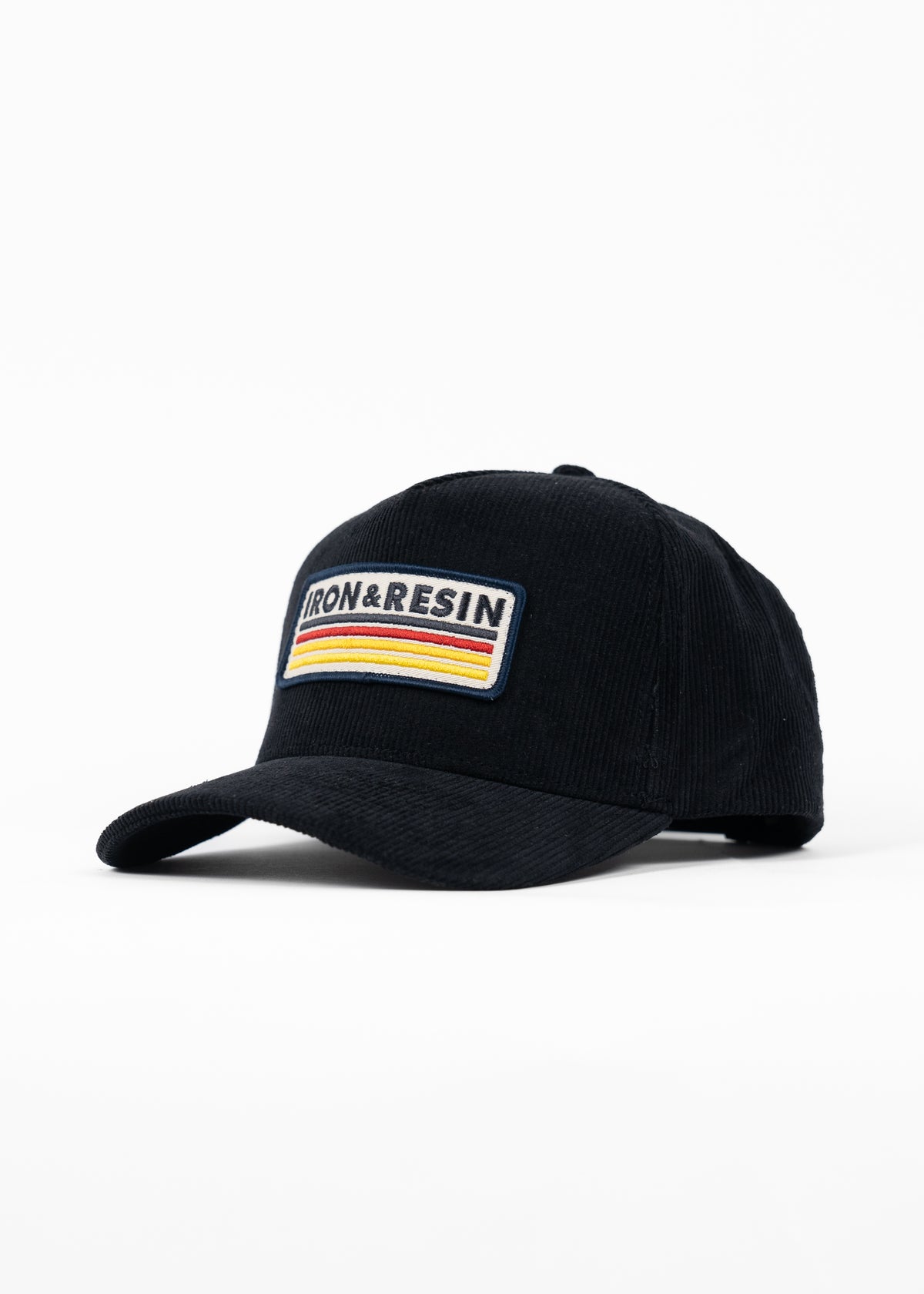 Black cap with "Iron & Resin" patch and colorful stripes on front, displayed on a white background.