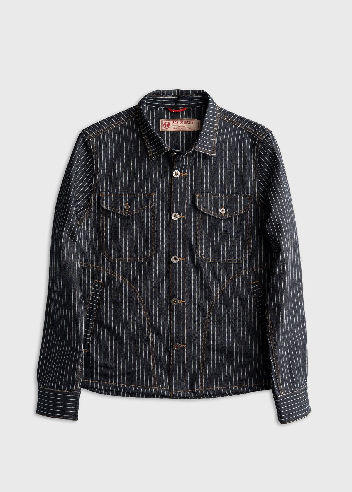 Striped denim jacket with buttoned front, two chest pockets, and label reading "Iron and Resin" on a plain white background.