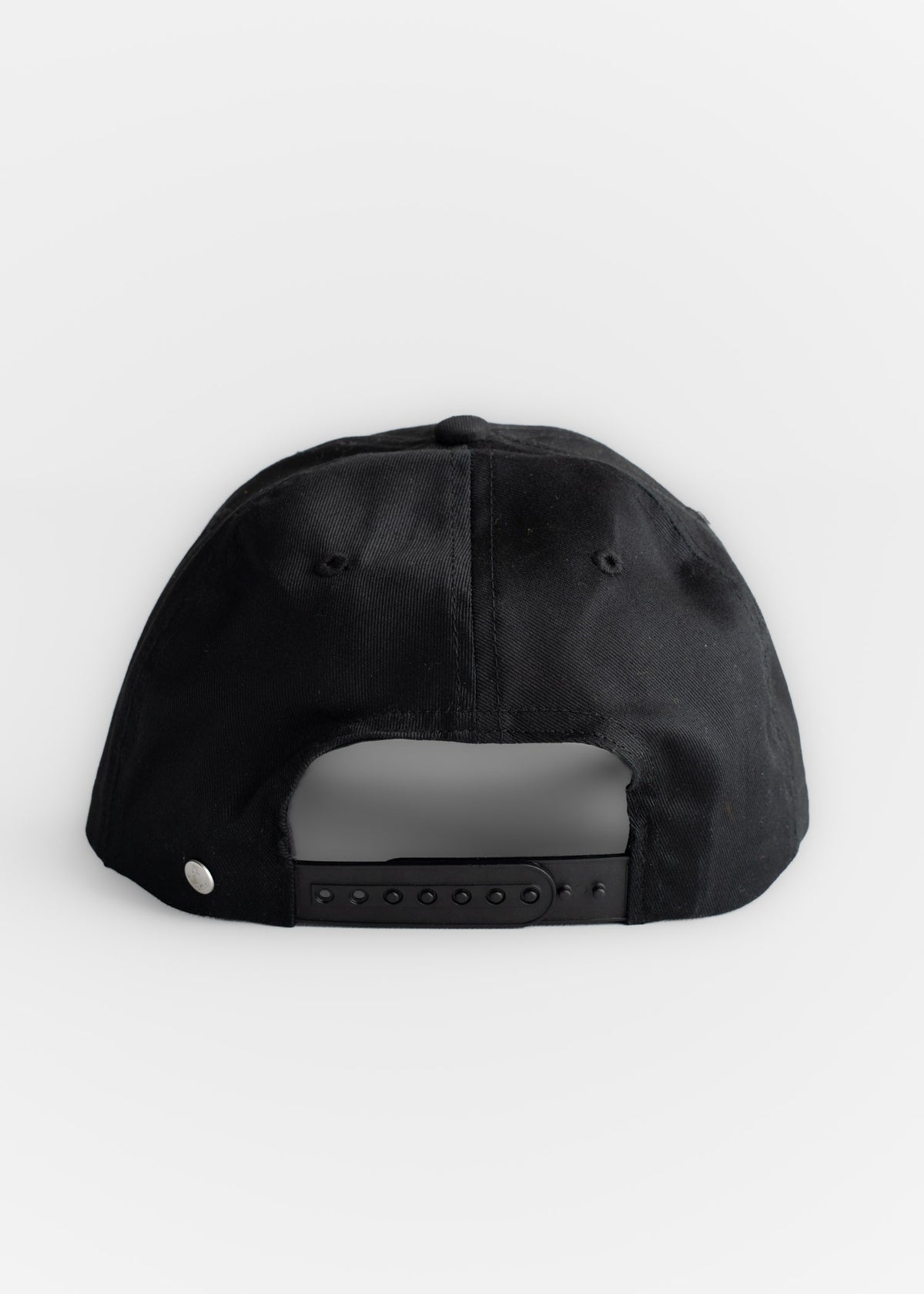 Close up of adjustable strap on hat, showcasing fit adjustment and rear closure detail