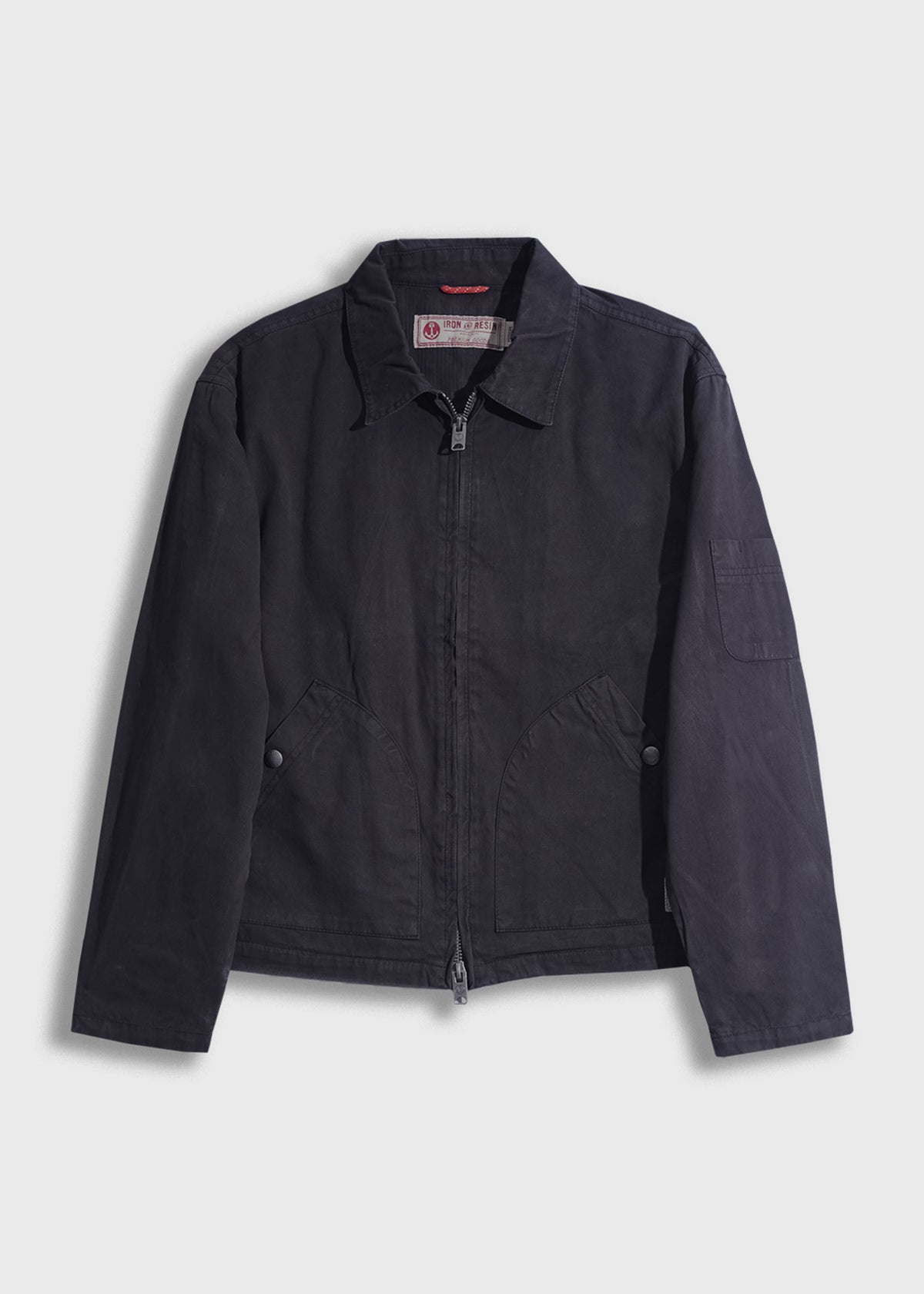 Dark blue jacket with a collar and front zipper, featuring two front pockets. Simple, classic design on a plain background.