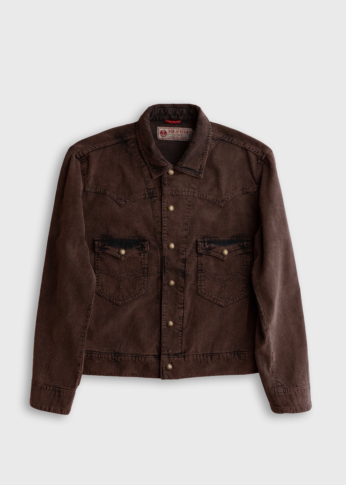 Brown corduroy jacket with button closure and two front pockets on a plain background, showcasing casual style and texture.