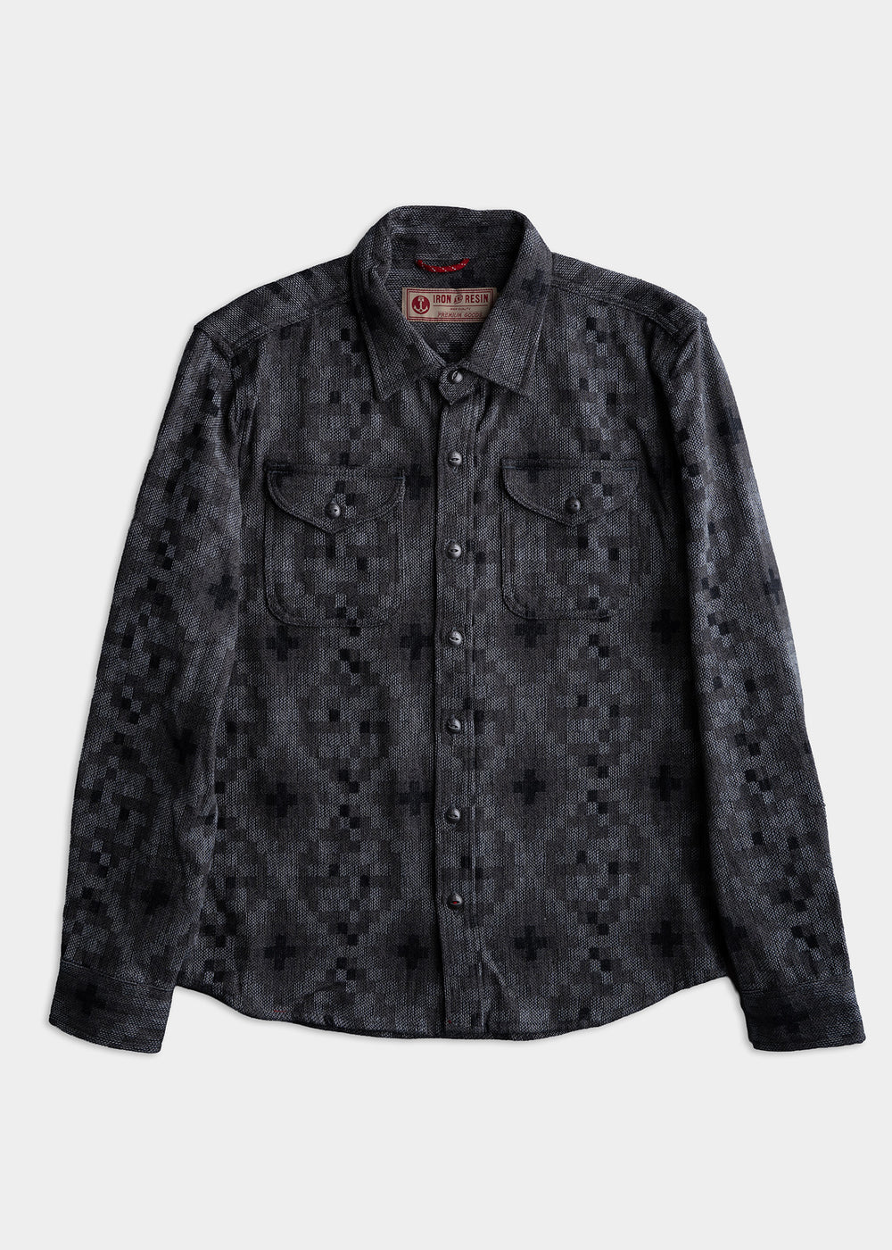 Gray button-up shirt with geometric pattern, featuring two chest pockets and a classic collar on a plain white background.