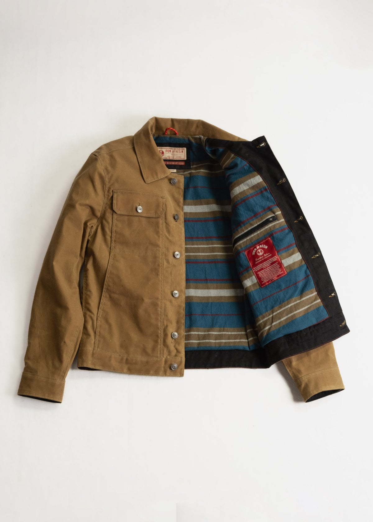 Brown jacket with striped blue and brown lining, open to reveal interior details. Silver buttons and chest pocket visible.