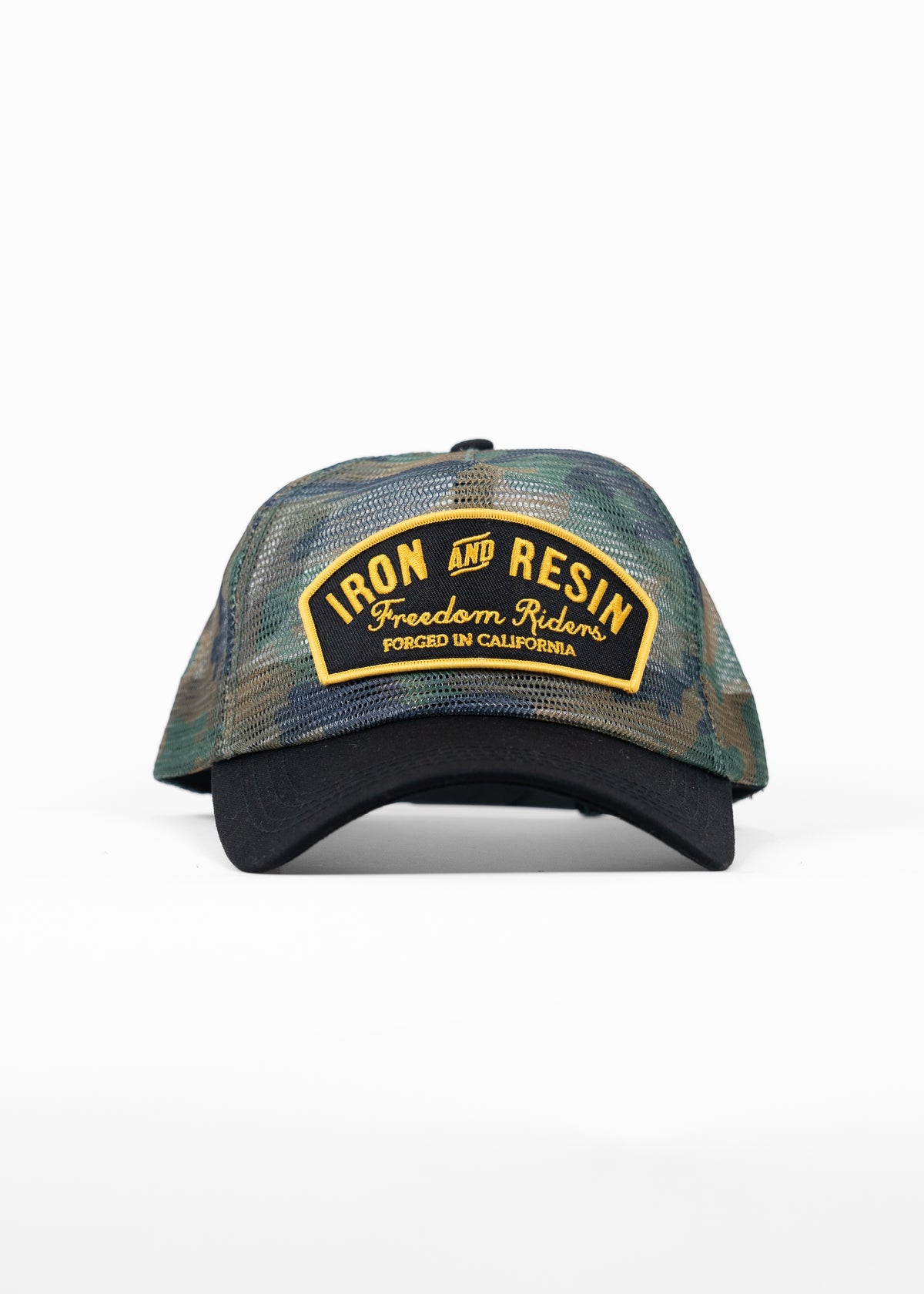 Camo trucker hat with "Iron and Resin, Freedom Riders, Forged in California" patch in yellow on front, black brim.