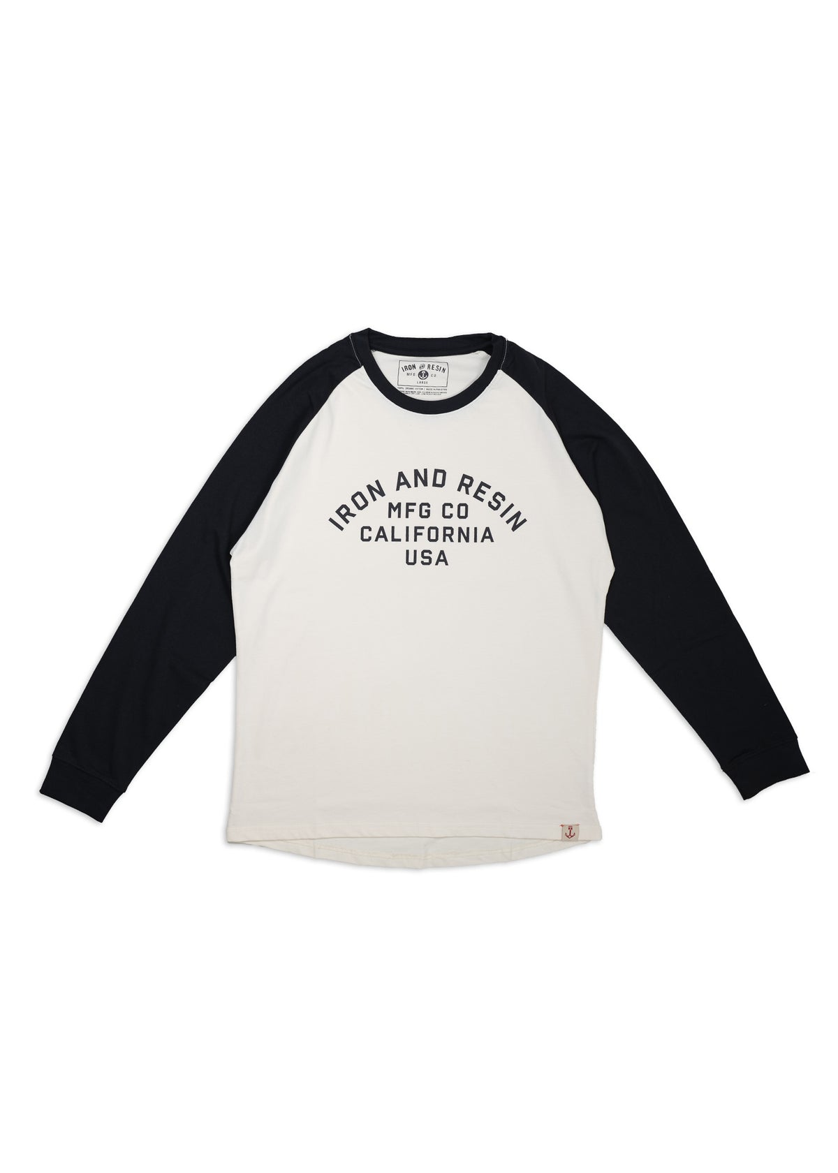White and black raglan shirt with "Iron and Resin MFG Co California USA" text. Long sleeves, casual style, laid flat.