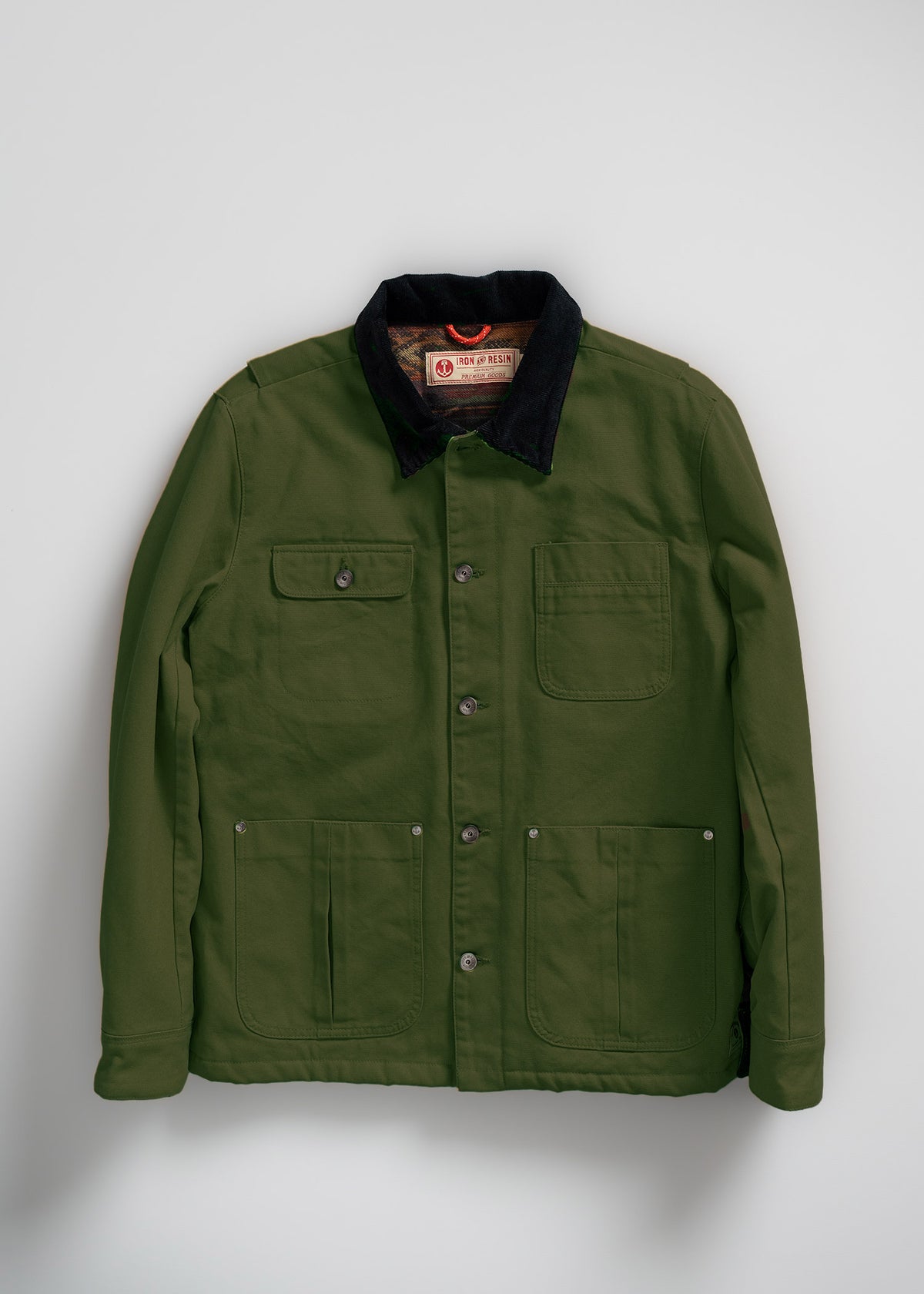 Green jacket with black collar, front pockets, and buttons, labeled "Iron & Resin," displayed against a plain white background.