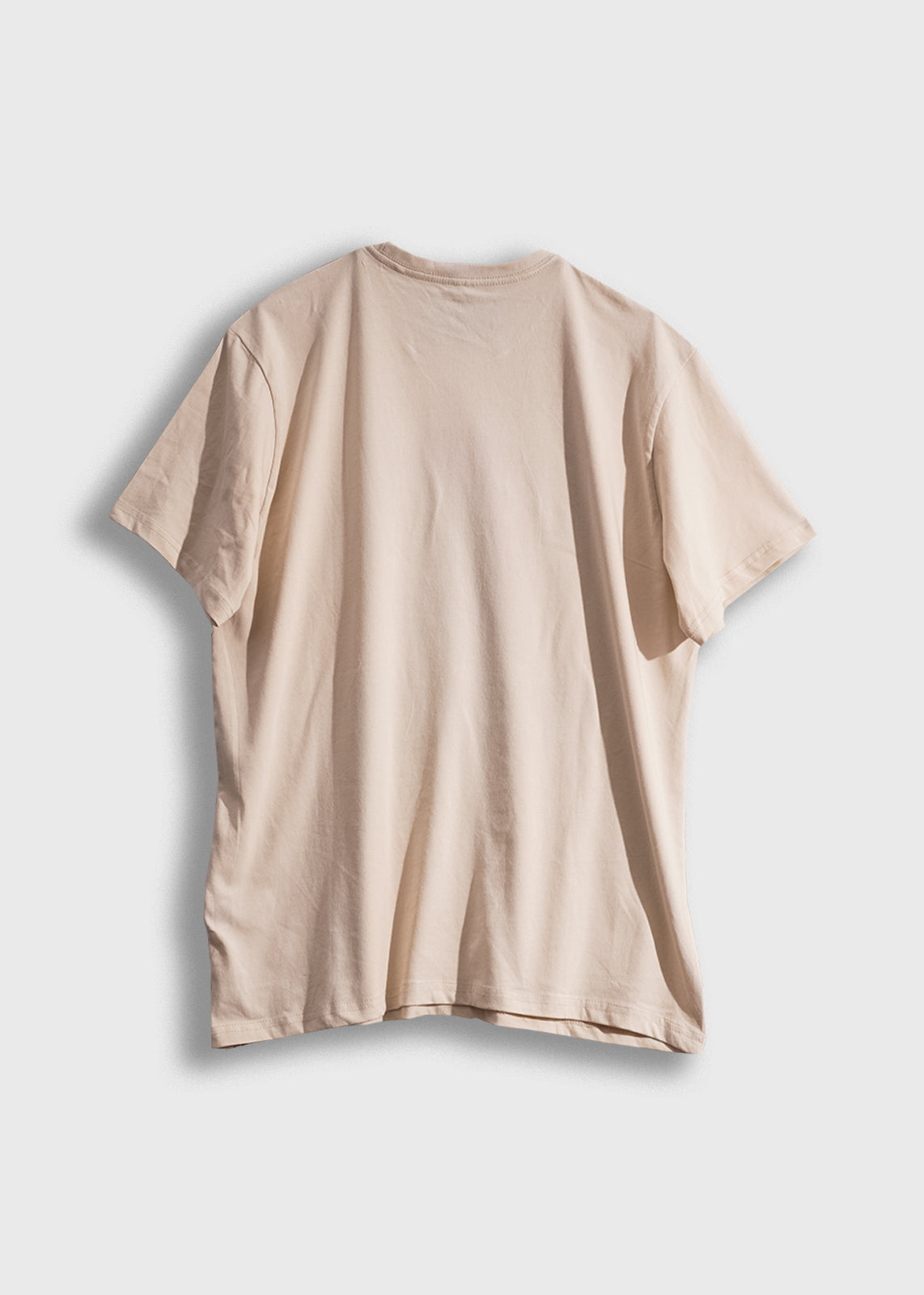 Beige T-shirt displayed on a white background, showcasing its back view and simple design.