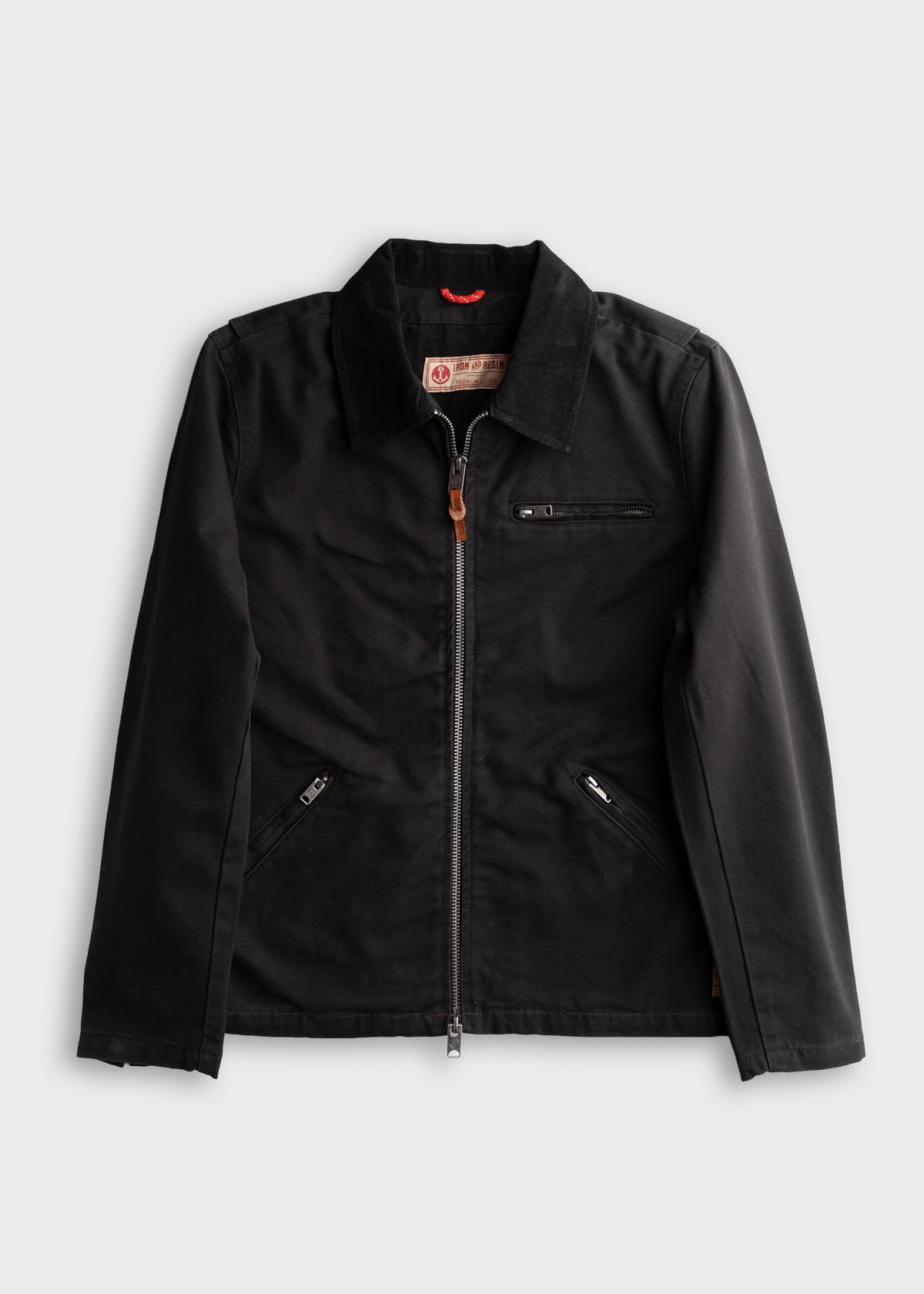 Black jacket with a front zipper, two side pockets, and a chest pocket, laid flat on a white background.