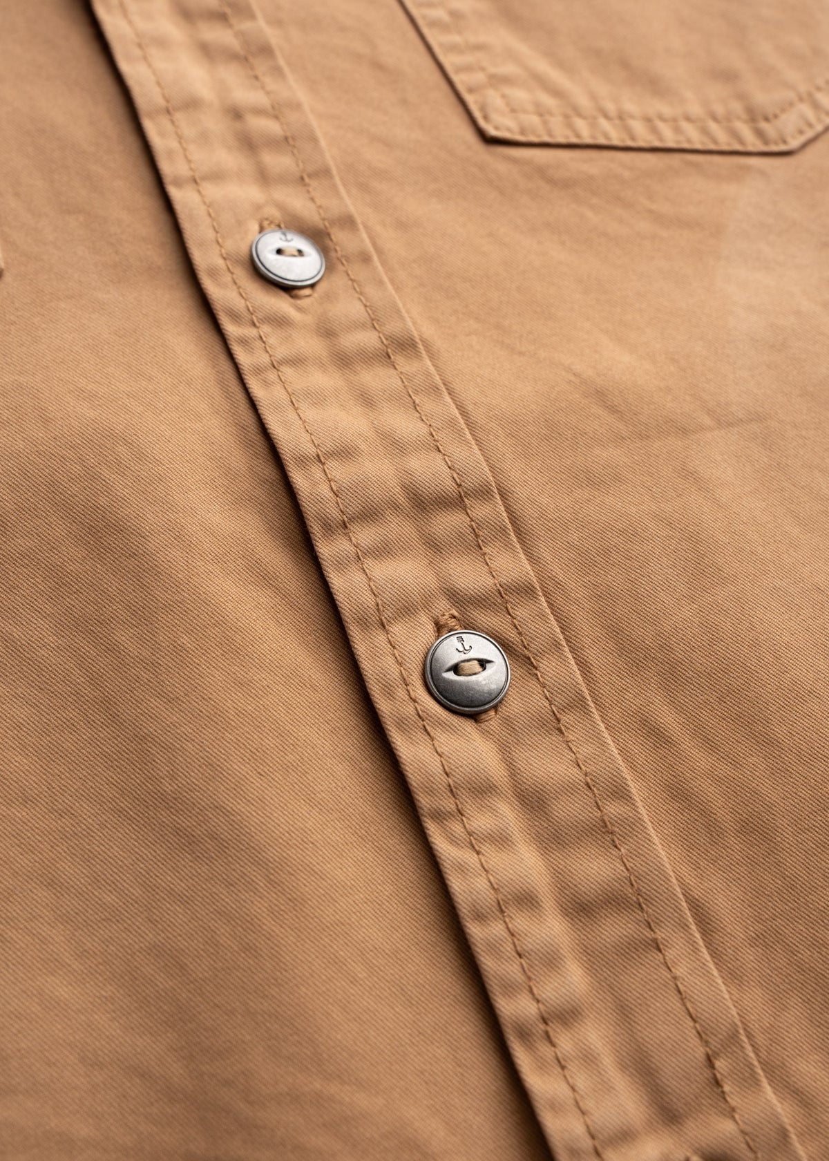 Men’s Prescott twill western button up shirt with embroidered detail, close-up shot showcasing custom buttons, and fabric quality