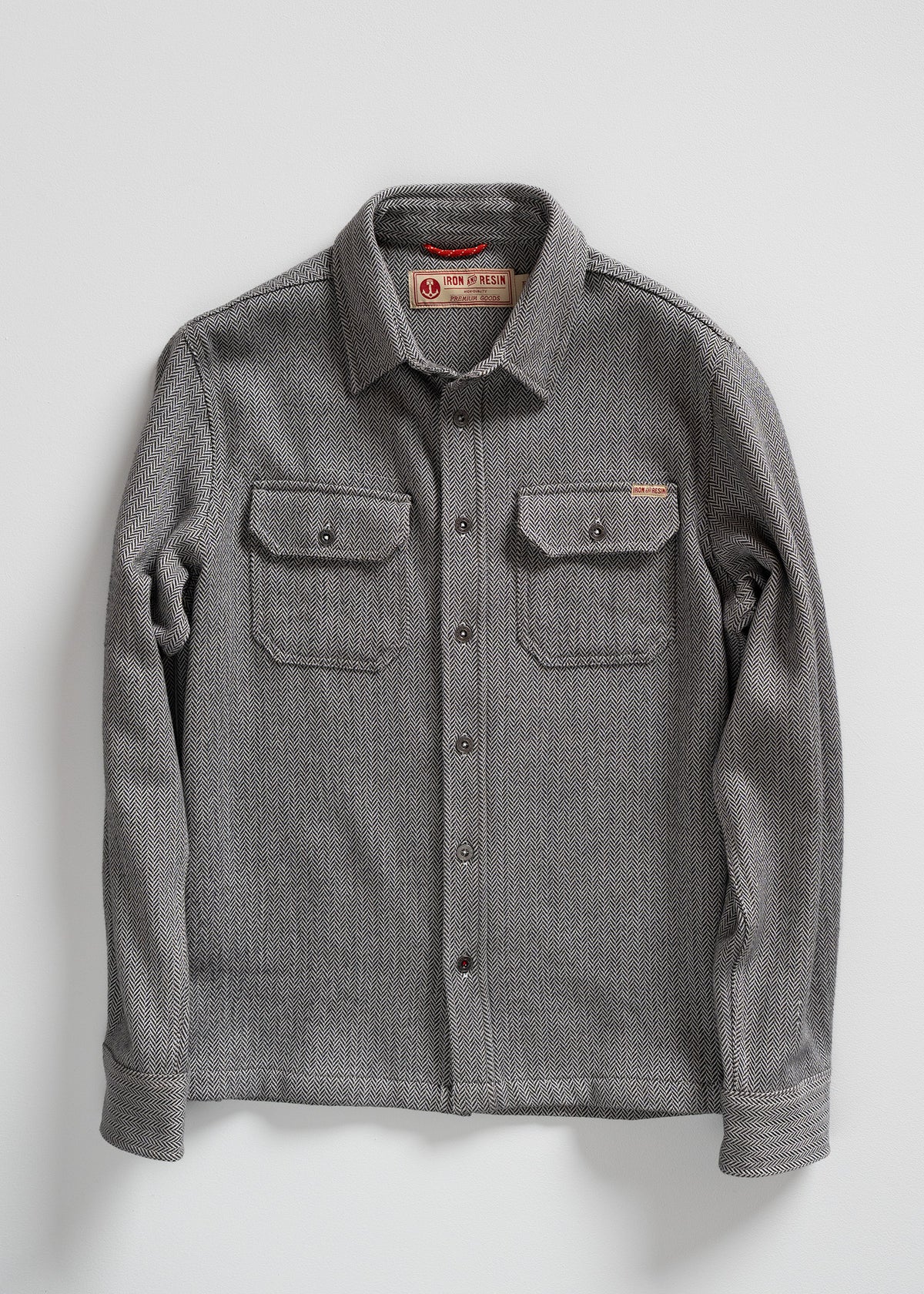 Gray herringbone button-up shirt with two chest pockets, displayed on a white background. Iron & Resin label visible inside.