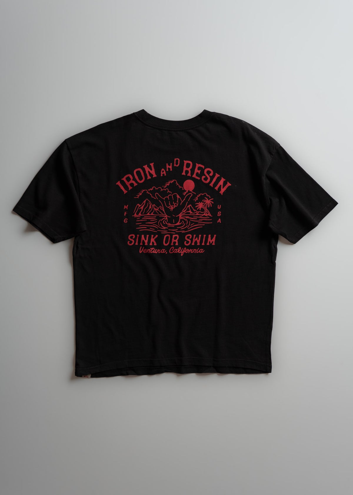Black T-shirt with red "Iron and Resin" logo, palm trees, and "Sink or Swim, Ventura, California" text on the back.