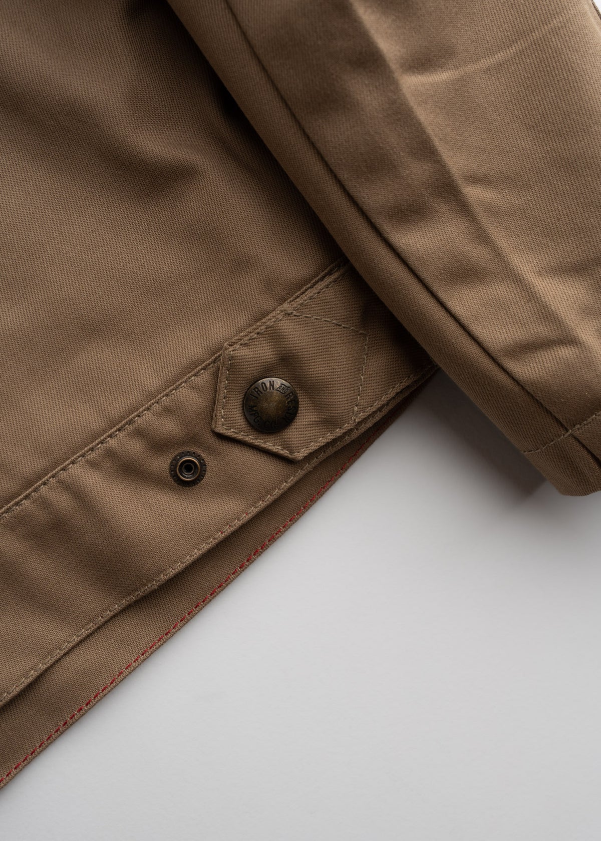 Close up of cotton poly blend fabric and custom hardware, showing durable weave and overall construction