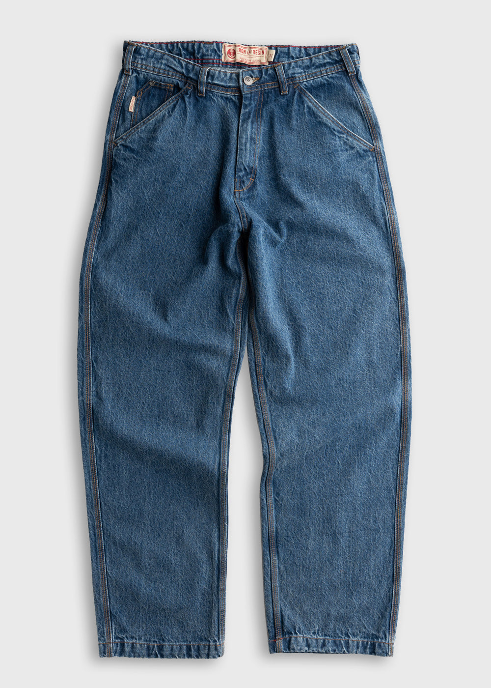 Blue denim jeans with a relaxed fit, featuring a button closure and front pockets, displayed on a plain white background.