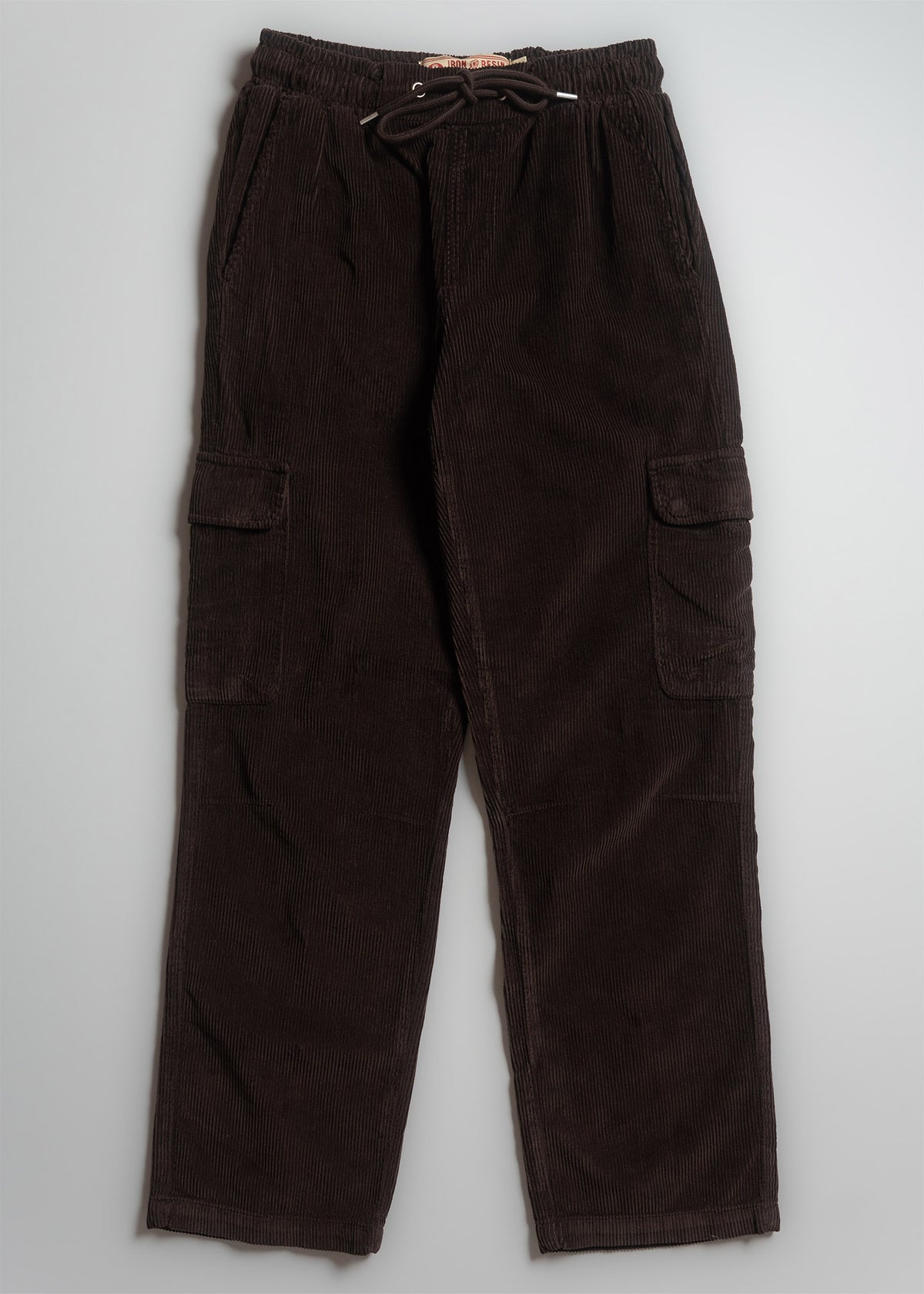 Dark brown corduroy cargo pants with drawstring waist and side pockets, laid flat on a light background.