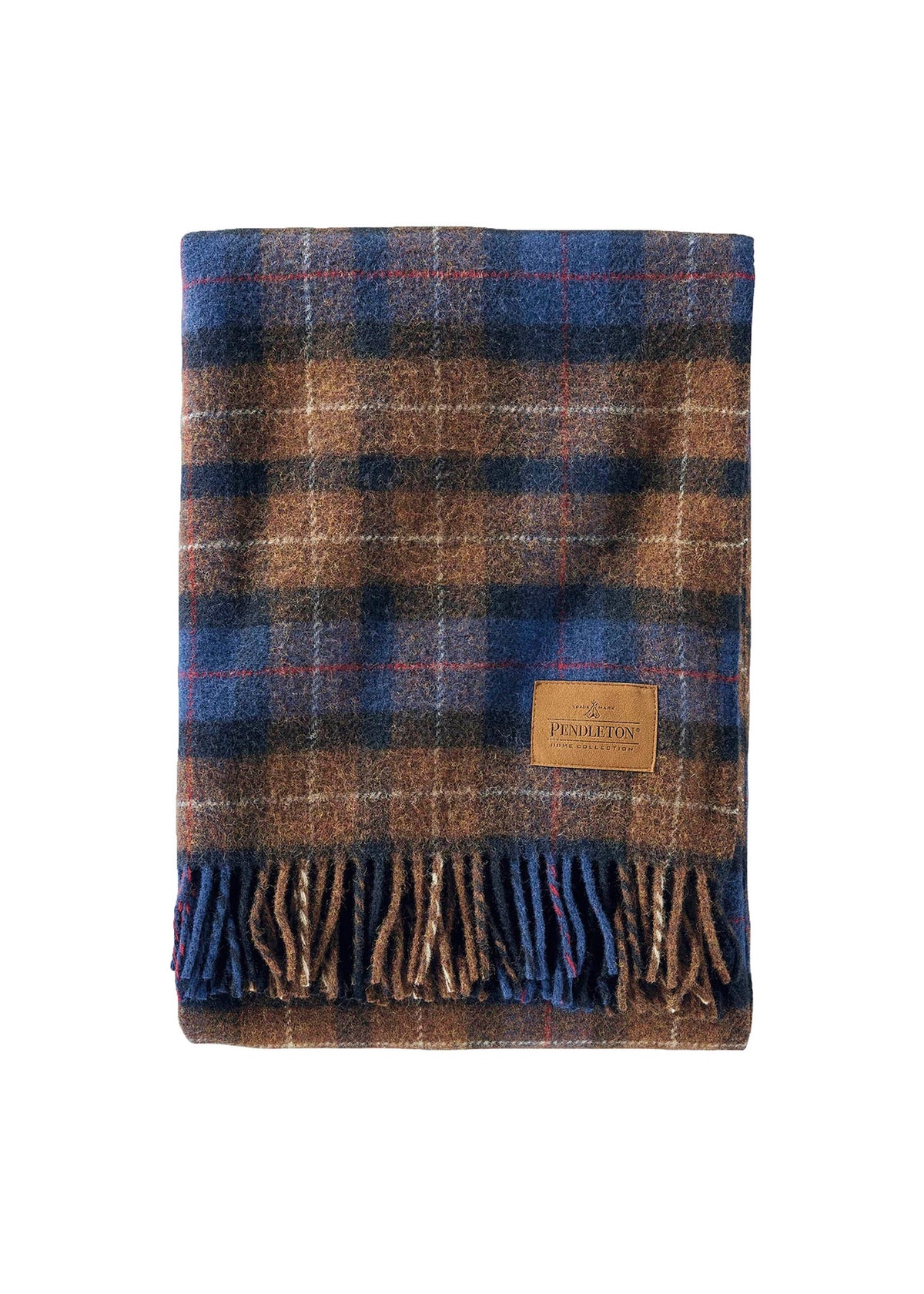 A folded Pendleton wool blanket with a blue and brown plaid pattern and fringe, featuring a leather logo patch on the front.