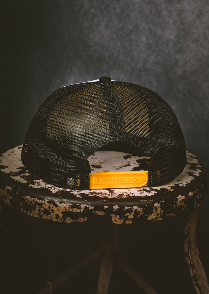 Iron & Resin Speedway Hat with Yellow Snapback in Black